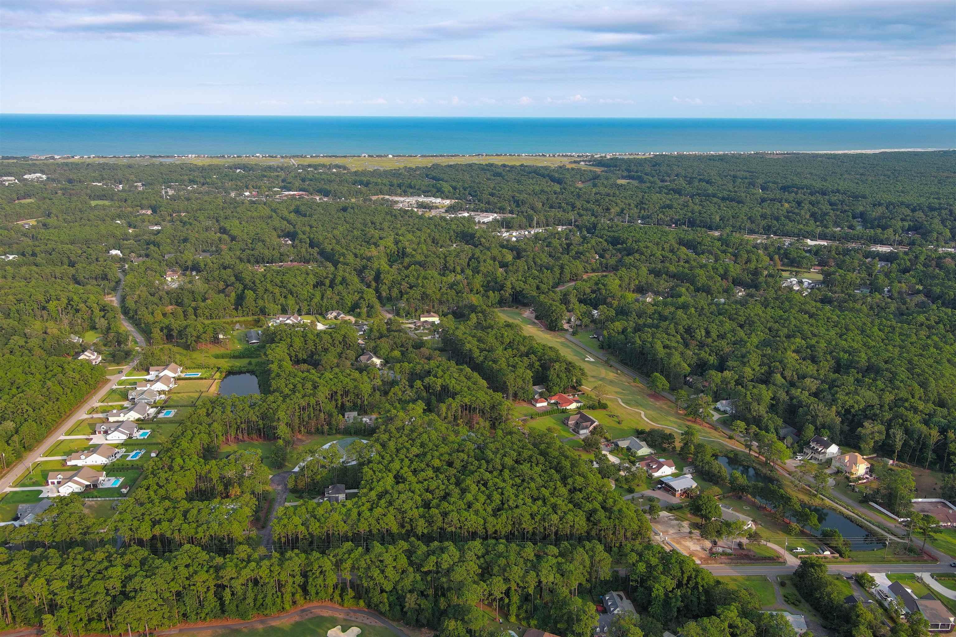 Image 2: View of property location featuring a forest and a Image 2: View of property location featuring a forest and a