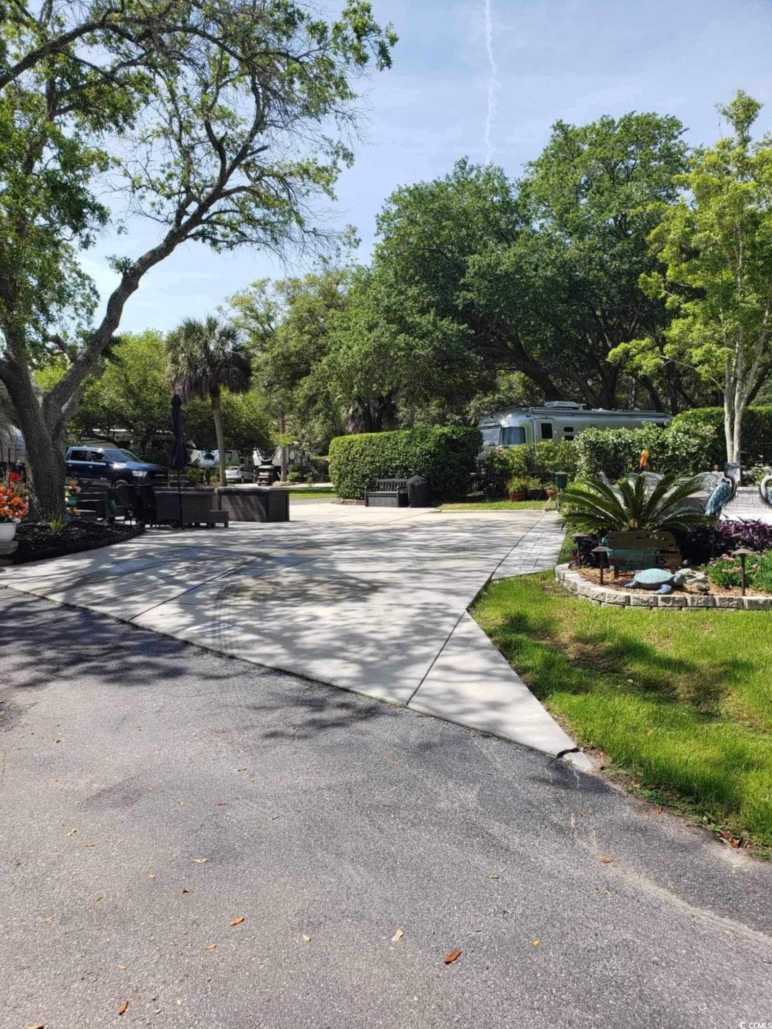 Image 2: View of asphalt driveway