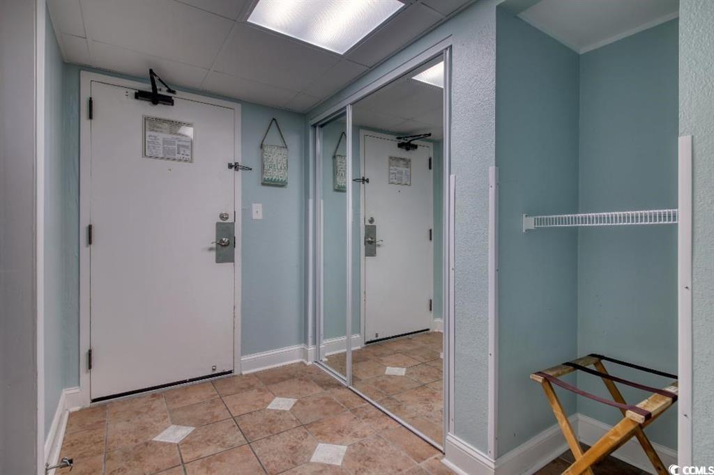 Image 2: Interior space featuring light tile patterned floo