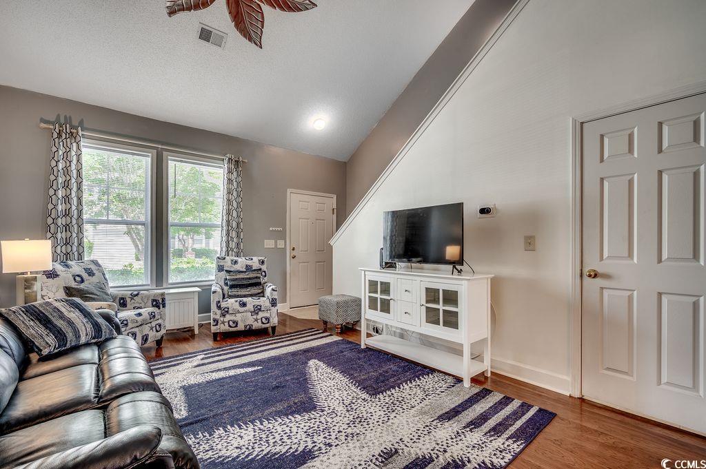 Image 2: Living room with vaulted ceiling and wood finished Image 2: Living room with vaulted ceiling and wood finished