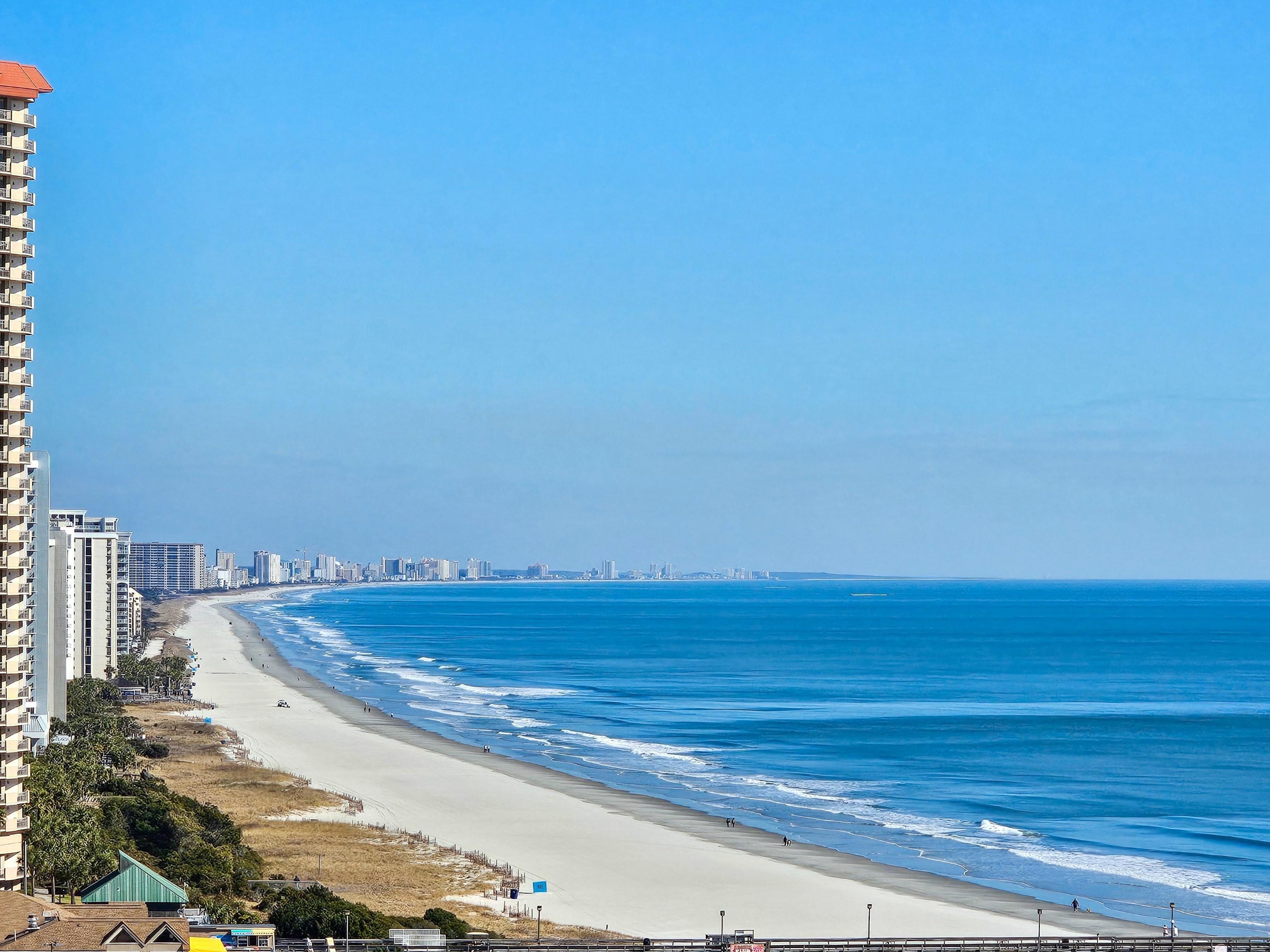 Image 3: Water view with nearby beach and skyline