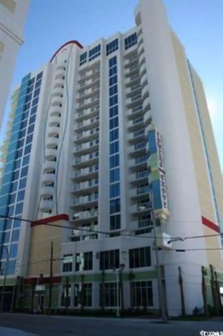 Image 1: View of apartment building / complex