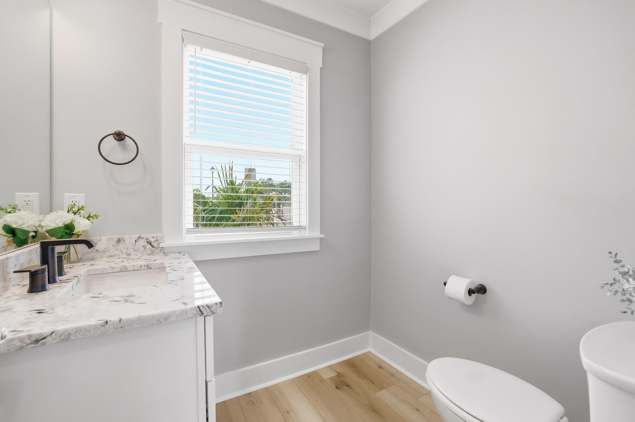 Image 3: Bathroom with vanity and light wood-style floors