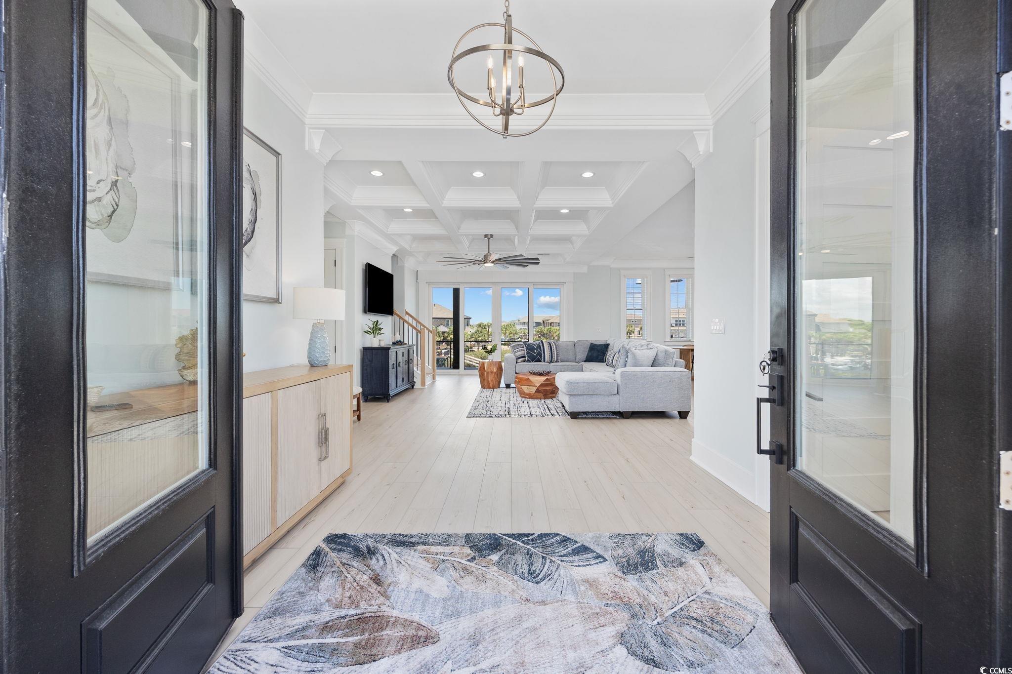 Image 2: Foyer entrance featuring coffered ceiling, beam ce