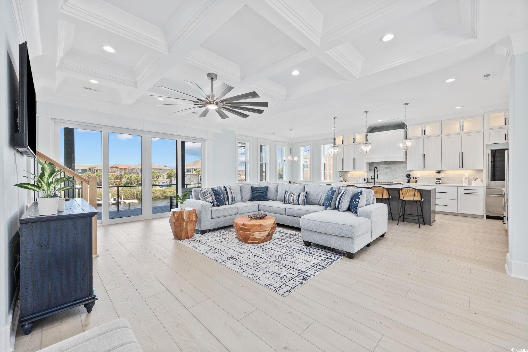 Image 3: Living area featuring beam ceiling, recessed light