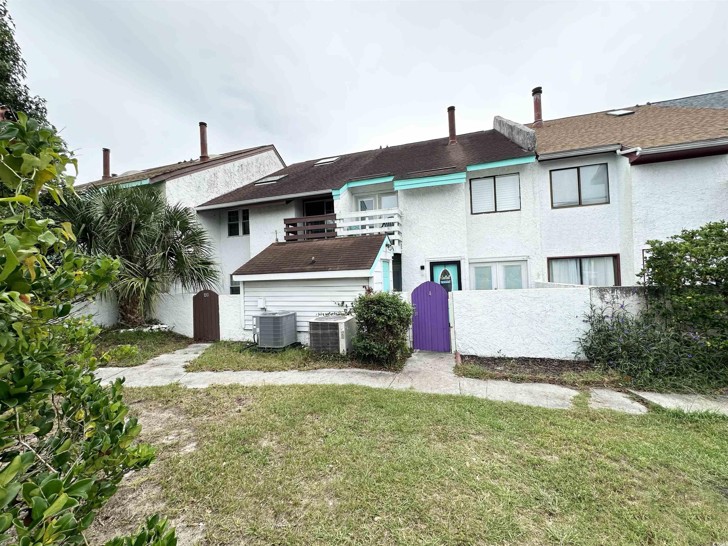 Image 3: Rear view of property with a yard and central air Image 3: Rear view of property with a yard and central air