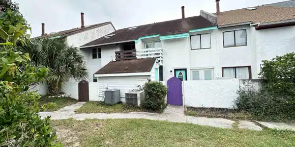 Image 3: Rear view of property with a yard and central air