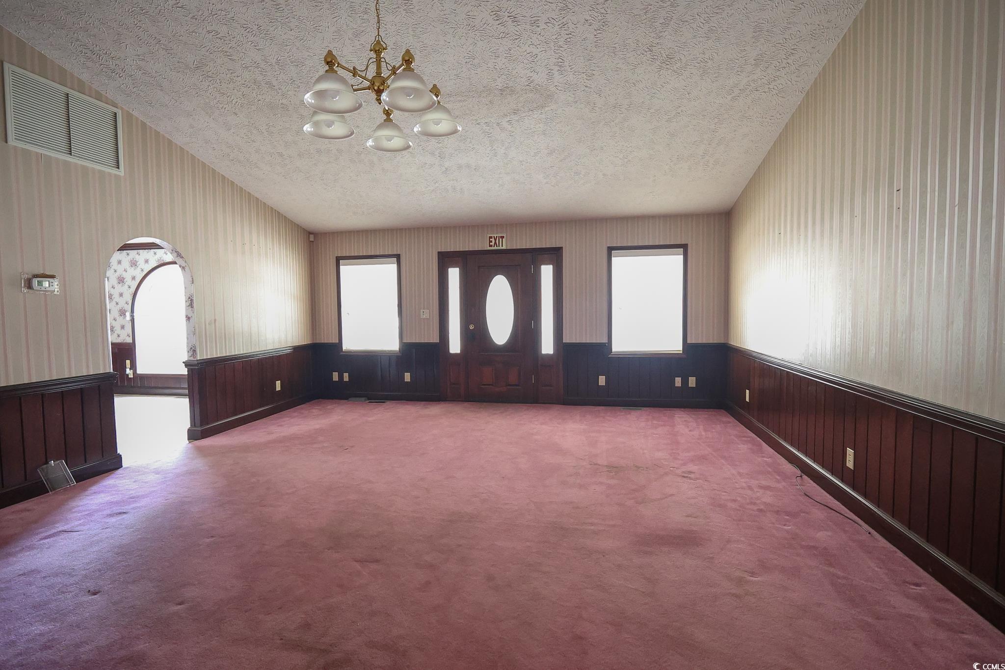 Image 3: Interior space with a textured ceiling, carpet flo Image 3: Interior space with a textured ceiling, carpet flo