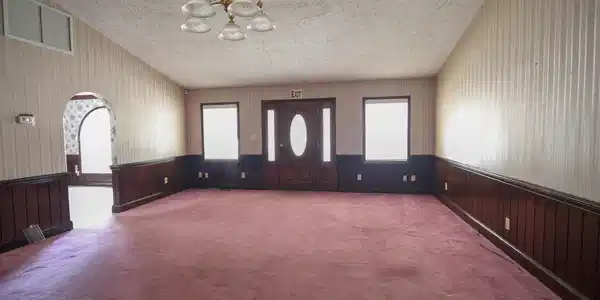 Image 3: Interior space with a textured ceiling, carpet flo