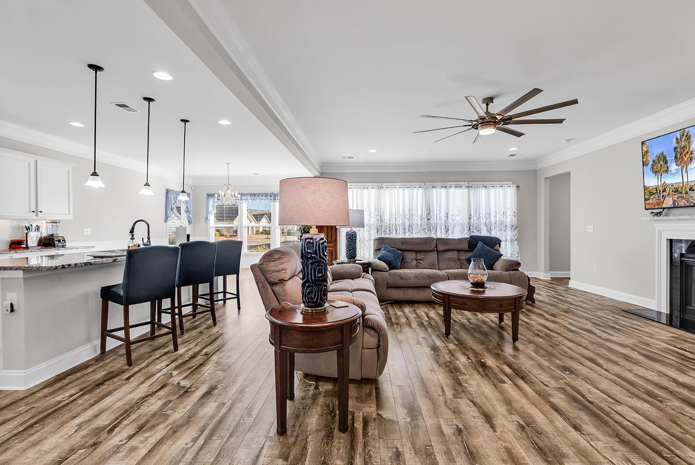 Image 4: Living room featuring crown molding, a chandelier, Image 4: Living room featuring crown molding, a chandelier,