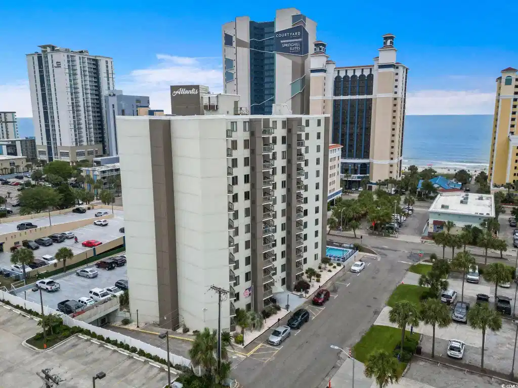 Image 1: Building is a half-block from the ocean ... less t