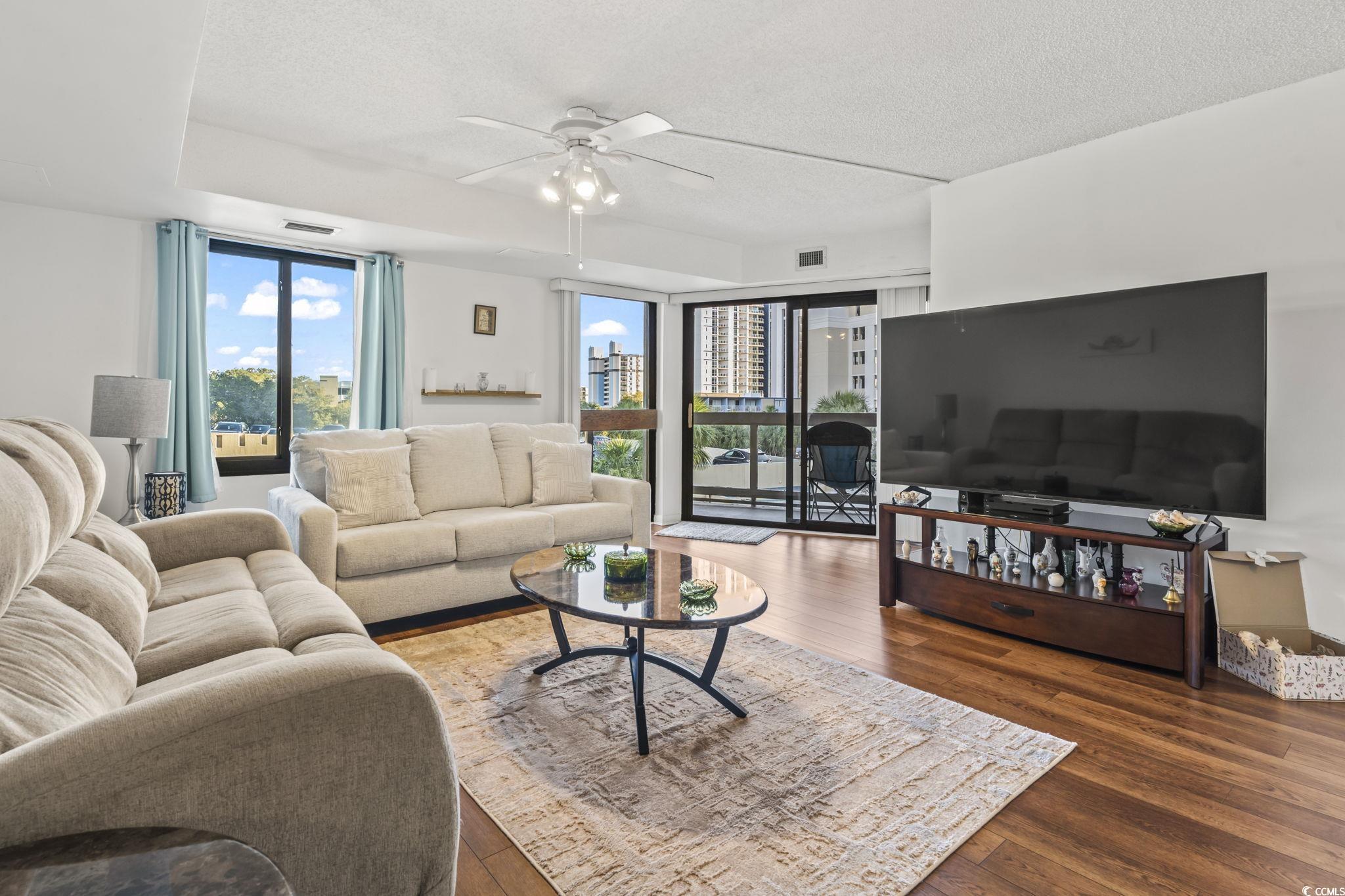 Image 2: Super Bright Living Room with Floor to Ceiling Gla