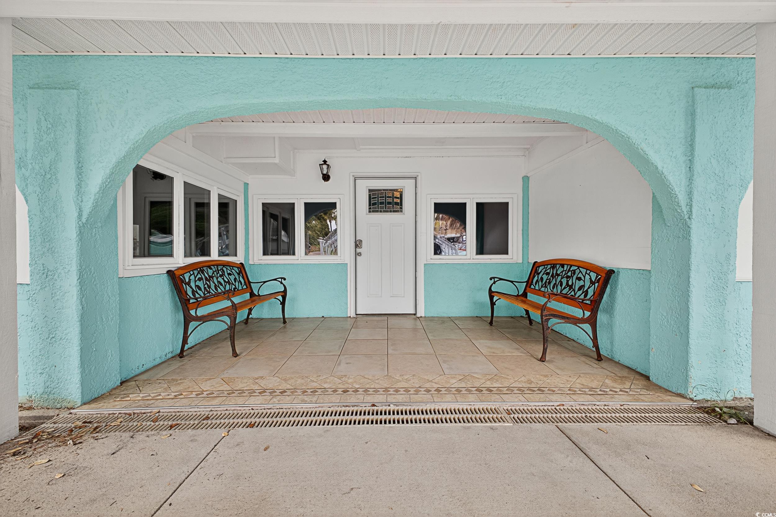 Image 4: Doorway to property with stucco siding