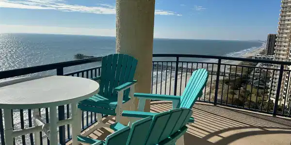 Image 3: Balcony with view of water and beach