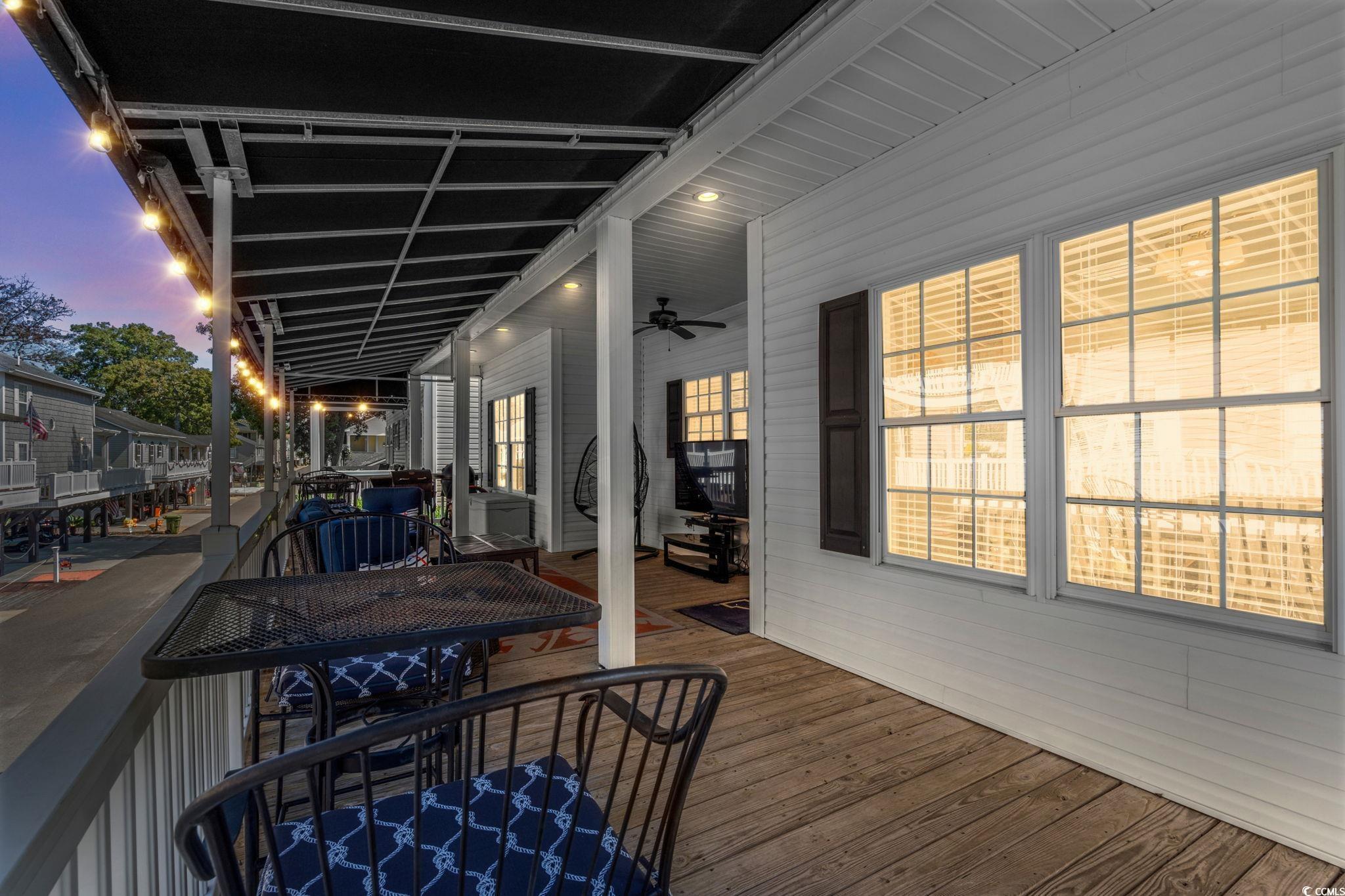 Image 3: Wooden deck with a ceiling fan Image 3: Wooden deck with a ceiling fan
