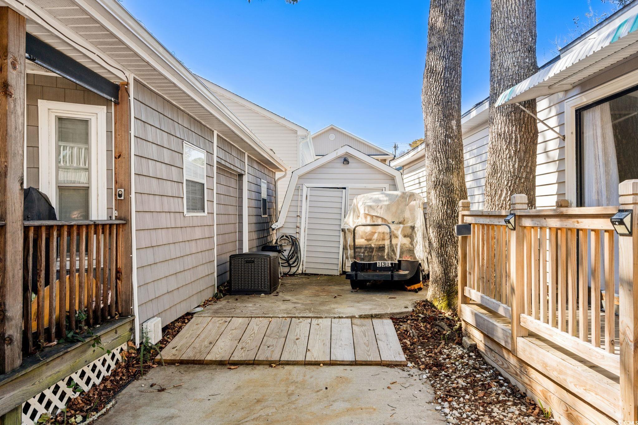 Image 3: View of patio / terrace featuring a deck and a she Image 3: View of patio / terrace featuring a deck and a she