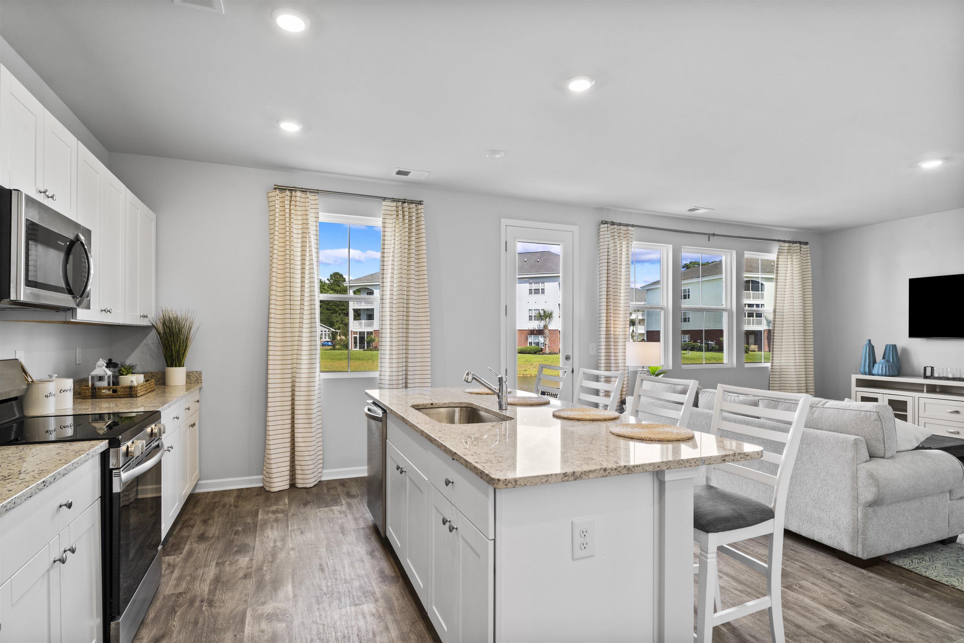 Image 3: Kitchen with appliances with stainless steel finis