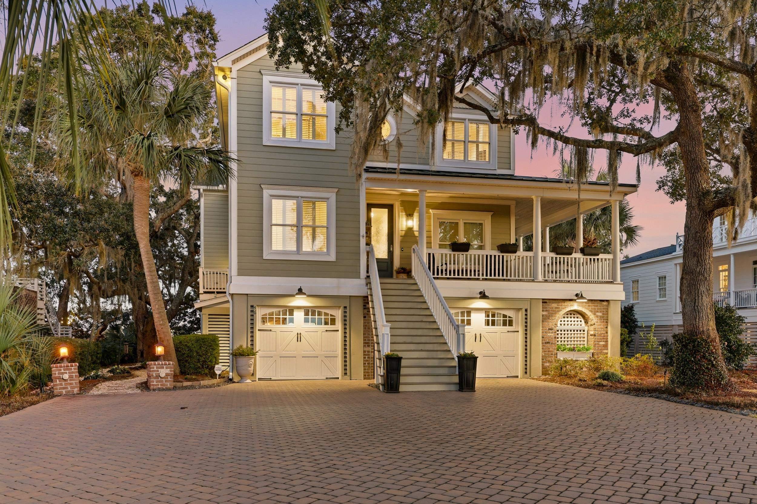 Image 1: Coastal inspired home featuring a porch, stairway,