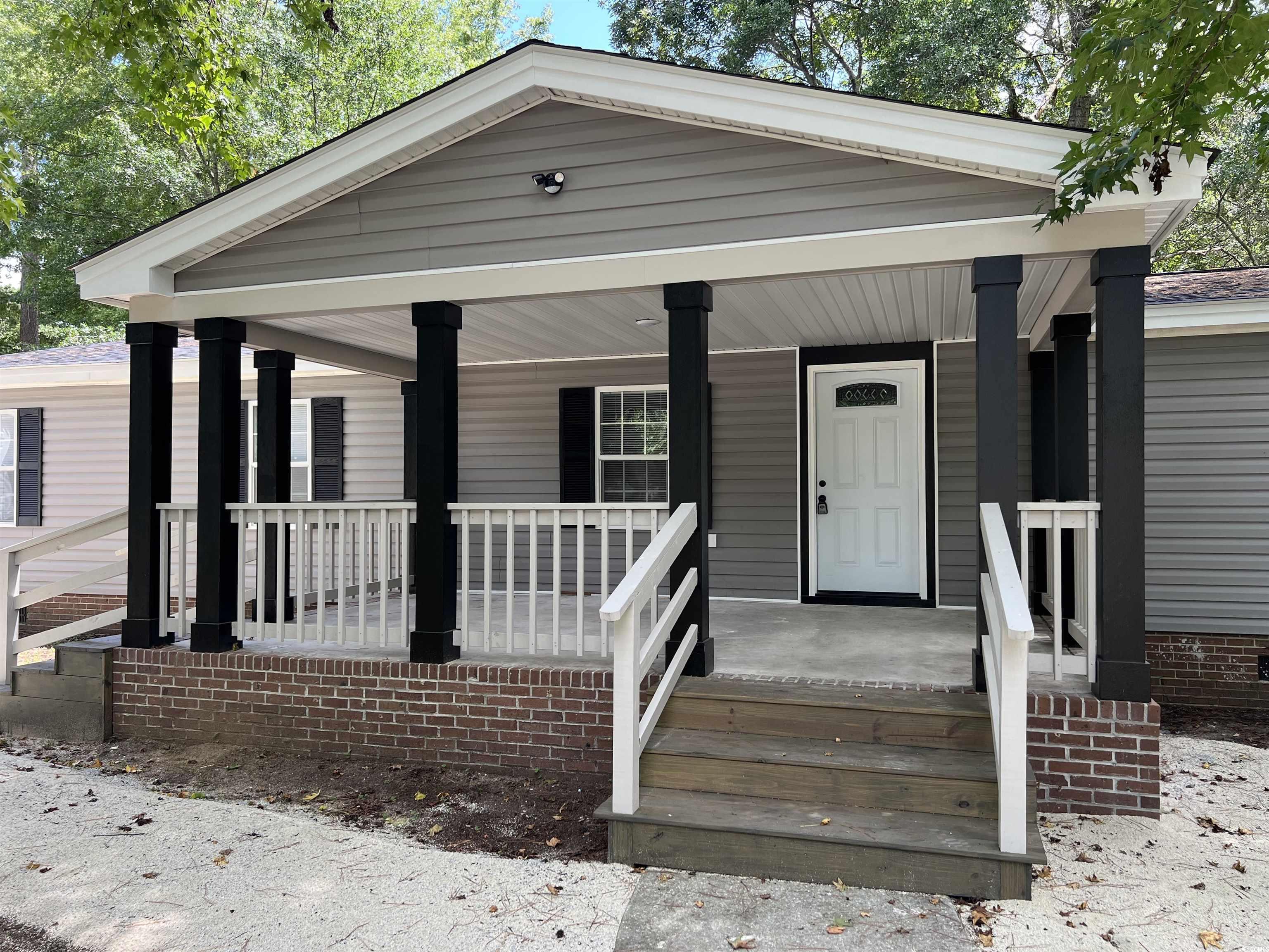 Image 3: View of front of house featuring a porch
