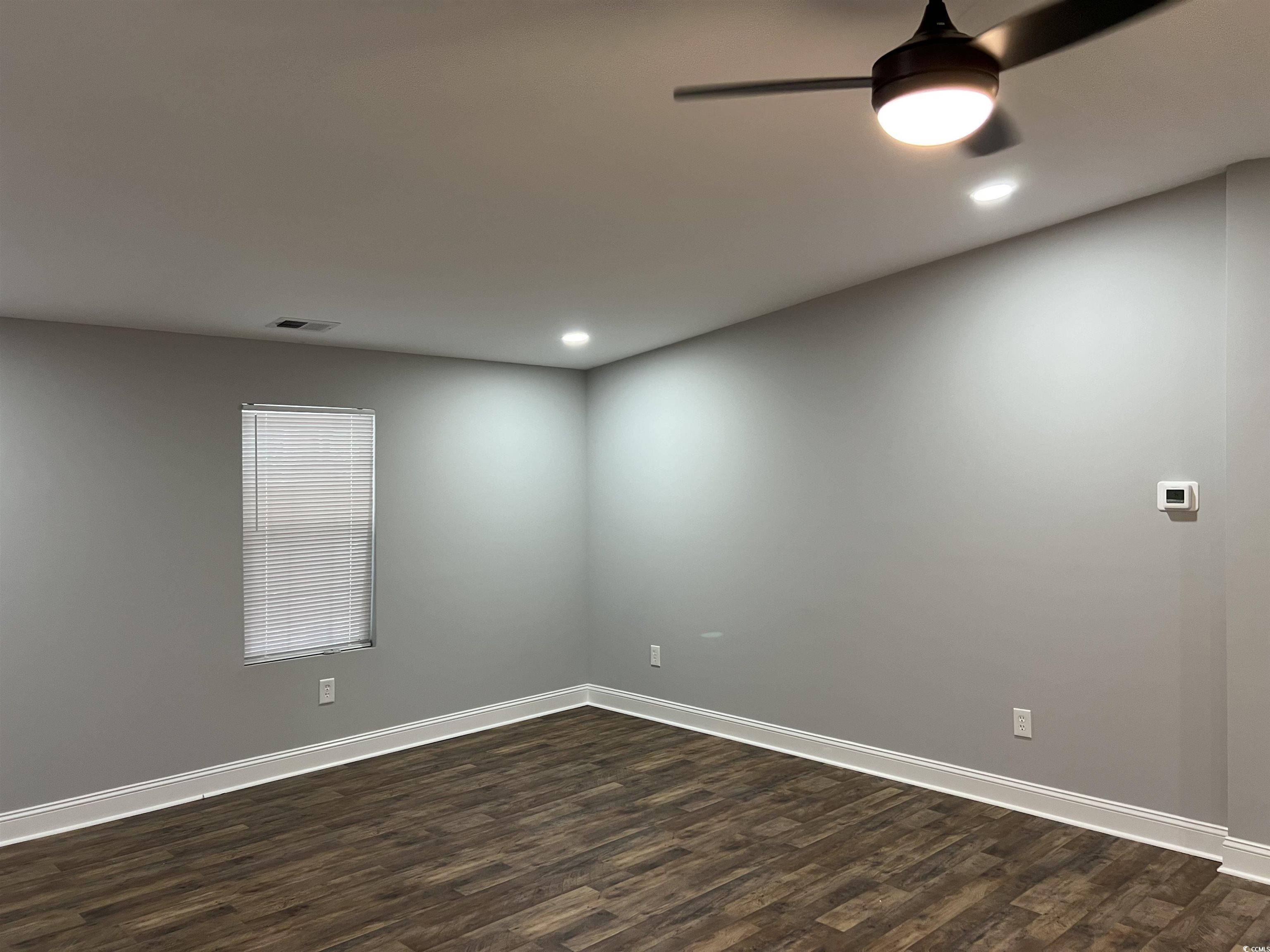 Image 4: Spare room featuring dark wood-style floors, ceili