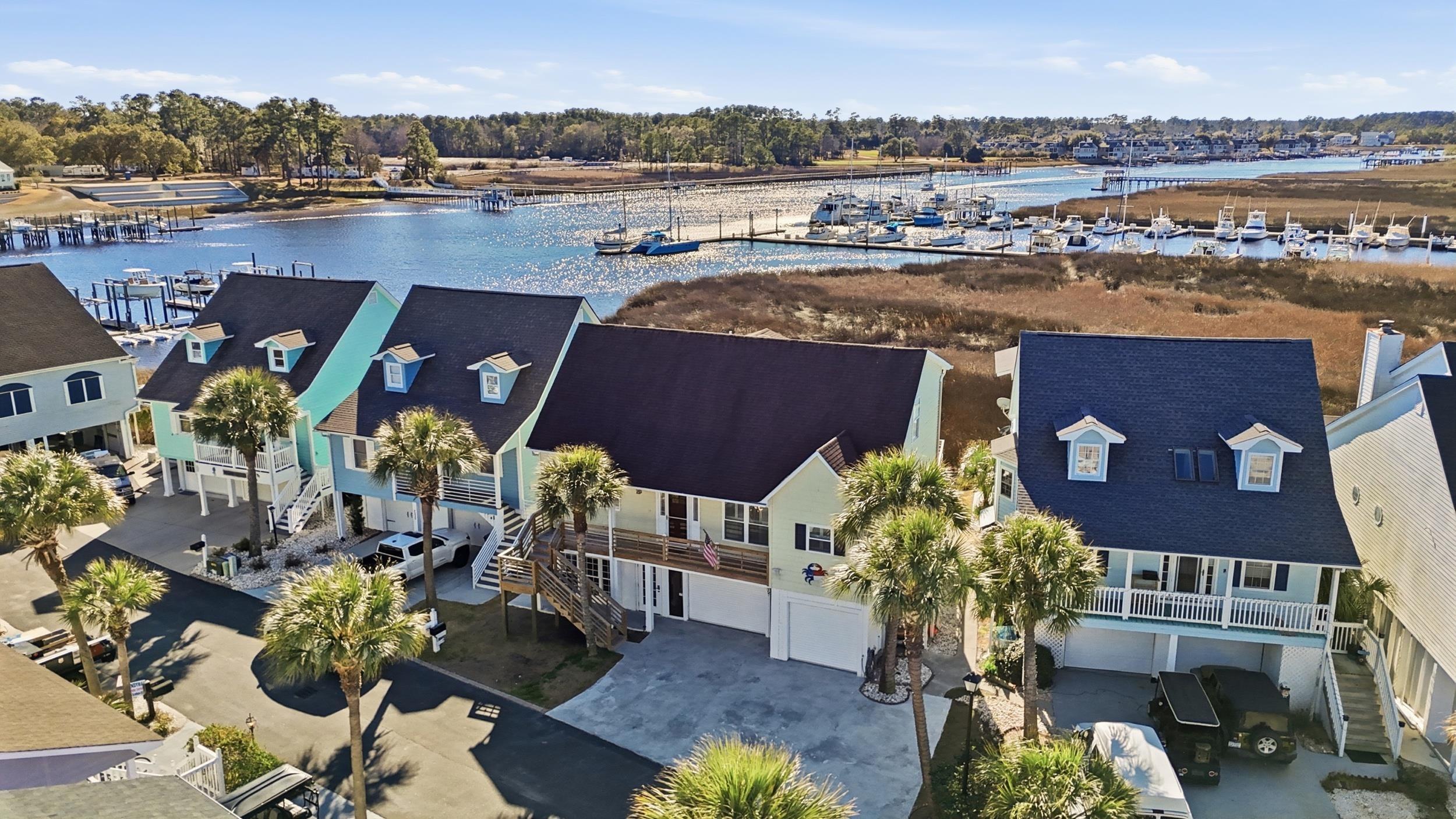 Image 2: Bird's eye view of a large body of water and a tre