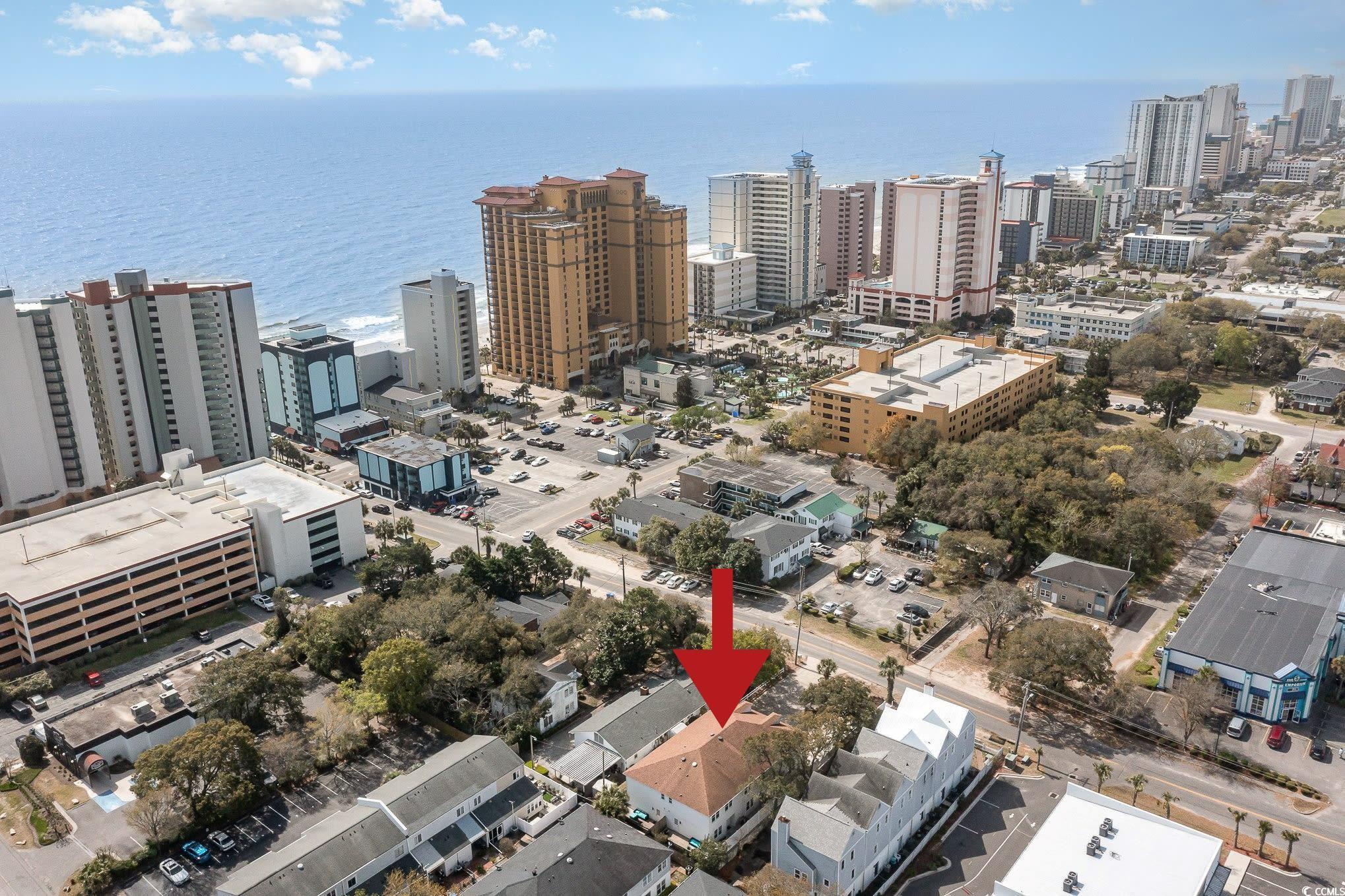 Image 2: View of urban area featuring a large body of water