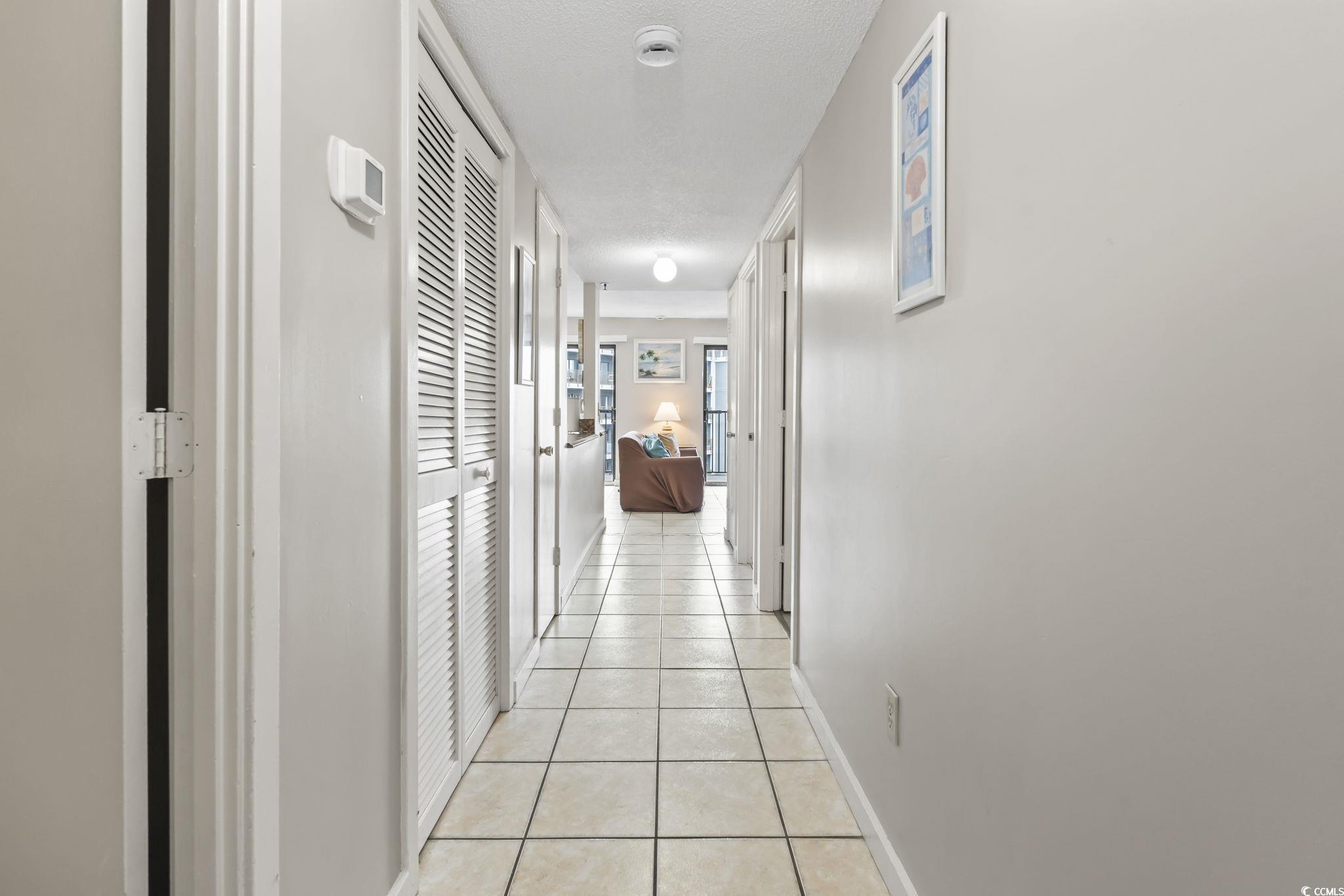 Image 2: Hallway featuring light tile patterned floors and Image 2: Hallway featuring light tile patterned floors and