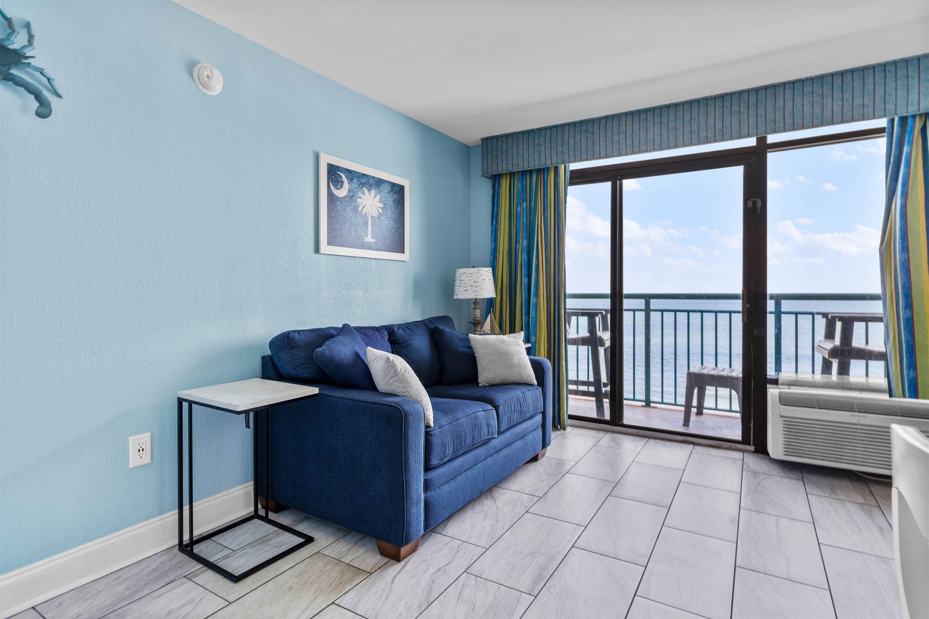 Image 3: Living area featuring a water view and baseboards Image 3: Living area featuring a water view and baseboards