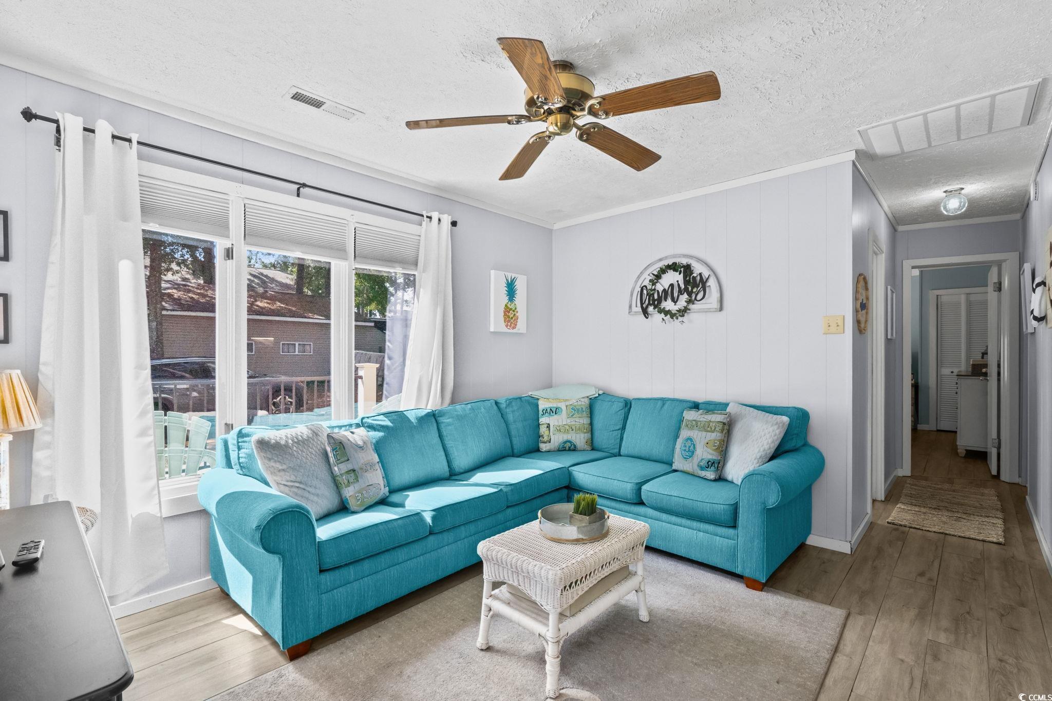 Image 3: Living area with crown molding, a textured ceiling Image 3: Living area with crown molding, a textured ceiling