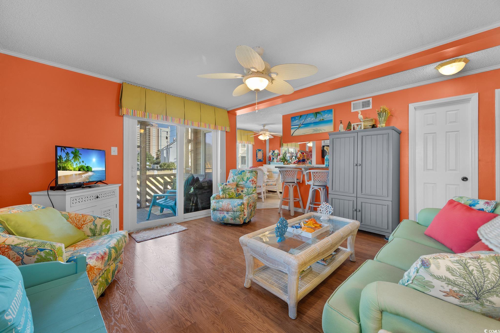 Image 2: Living room with crown molding, wood finished floo Image 2: Living room with crown molding, wood finished floo