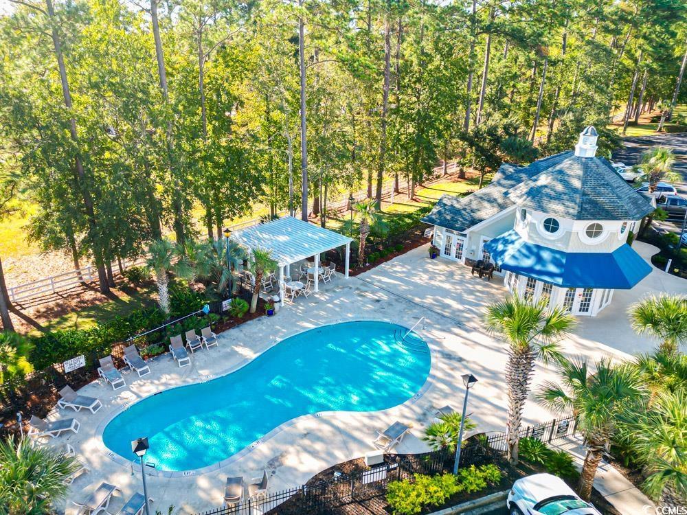 Image 2: Community pool with a patio area, french doors, an Image 2: Community pool with a patio area, french doors, an