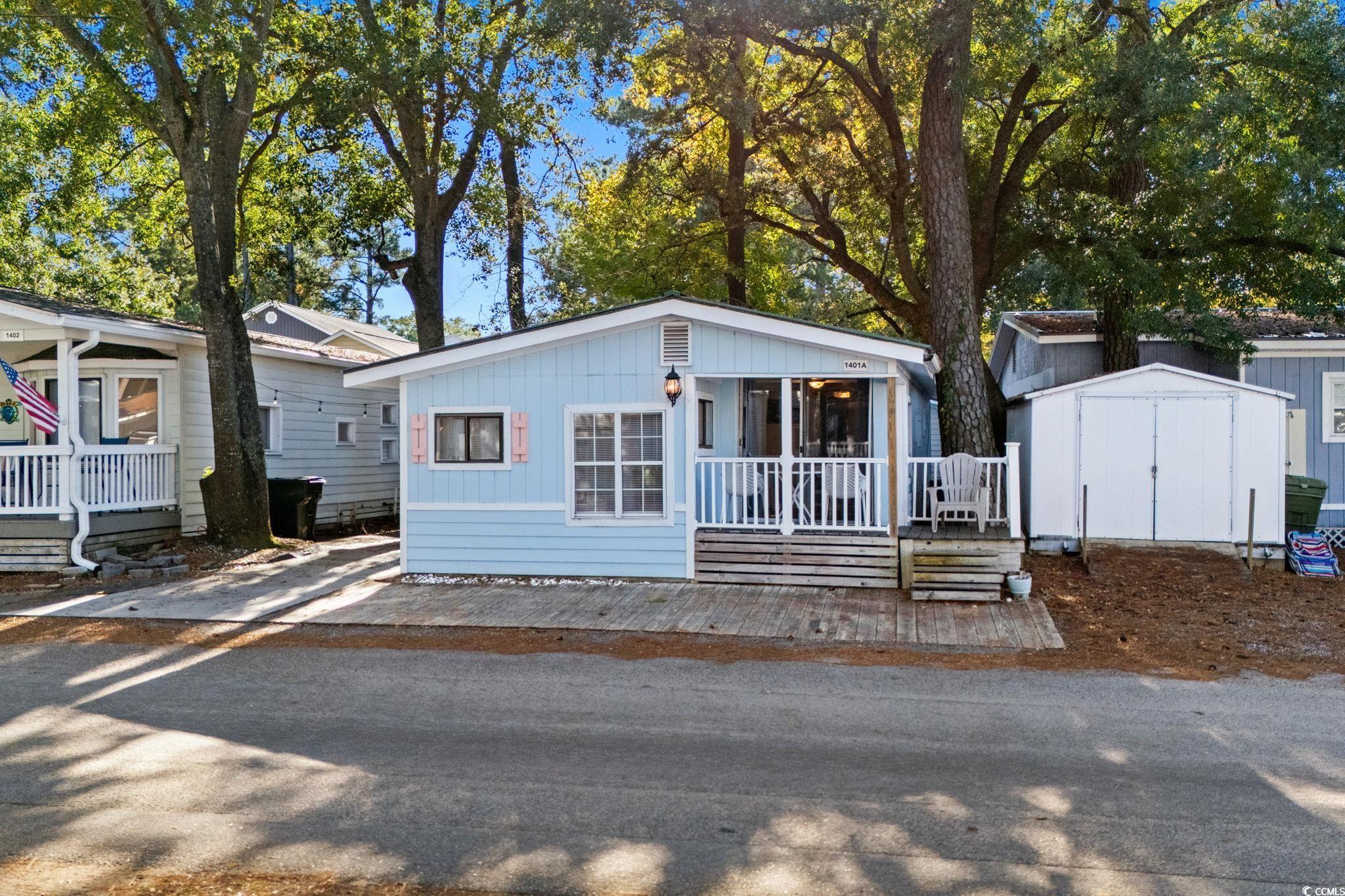 Image 2: View of front facade with a shed Image 2: View of front facade with a shed