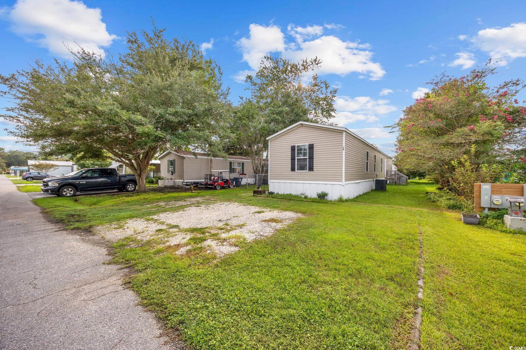 Image 4: View of property exterior with a yard Image 4: View of property exterior with a yard
