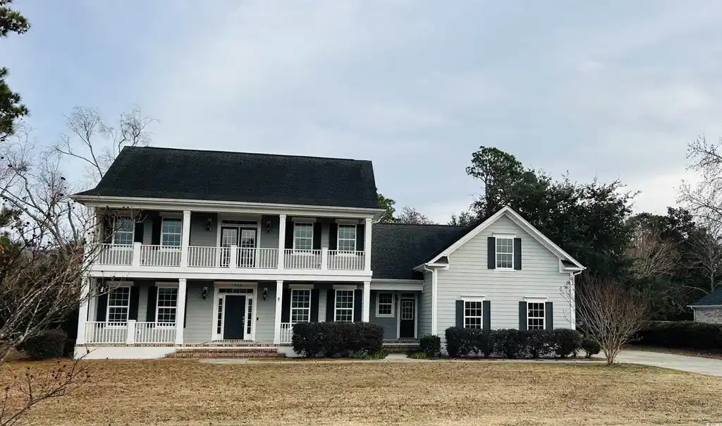 Image 1: View of front of house featuring covered porch and