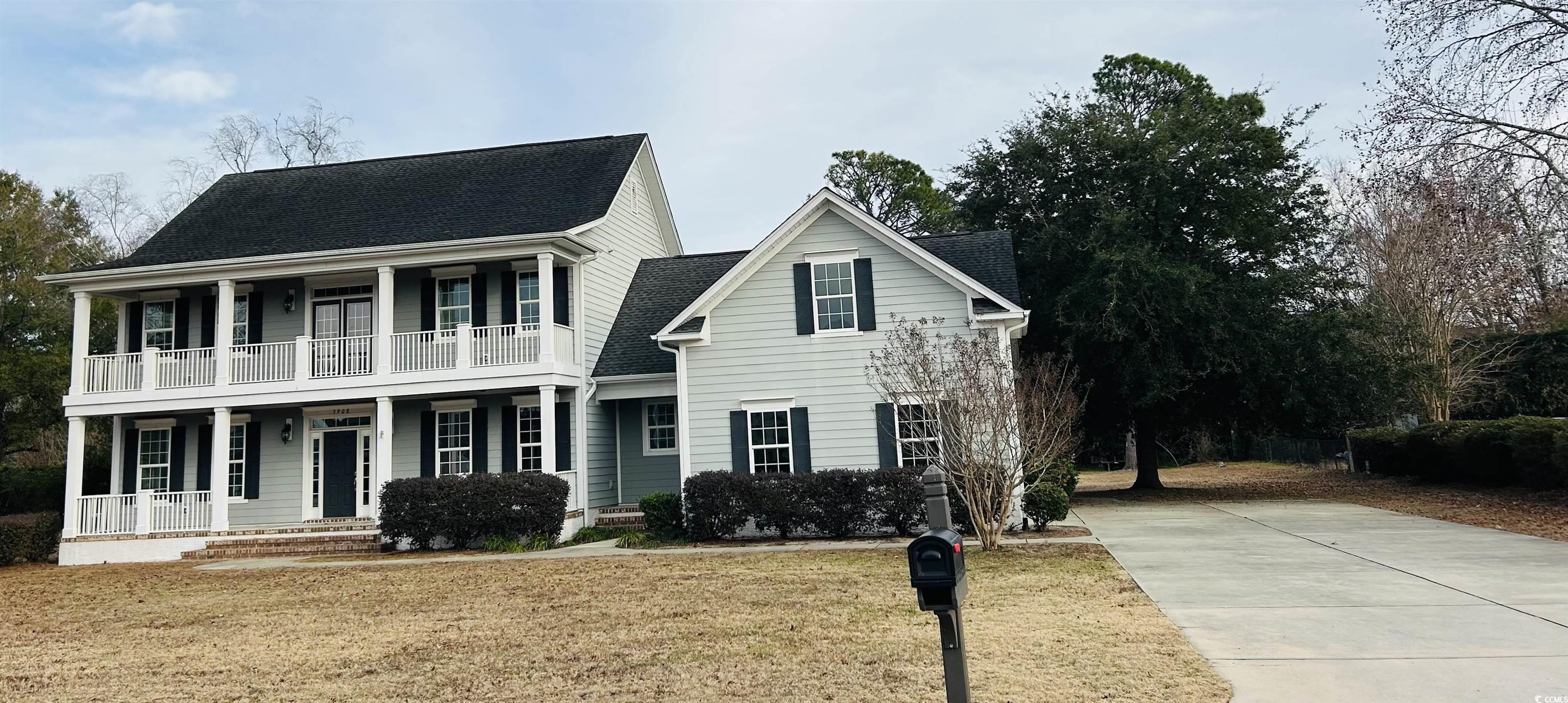 Image 2: View of front facade with a porch, a front yard, a Image 2: View of front facade with a porch, a front yard, a