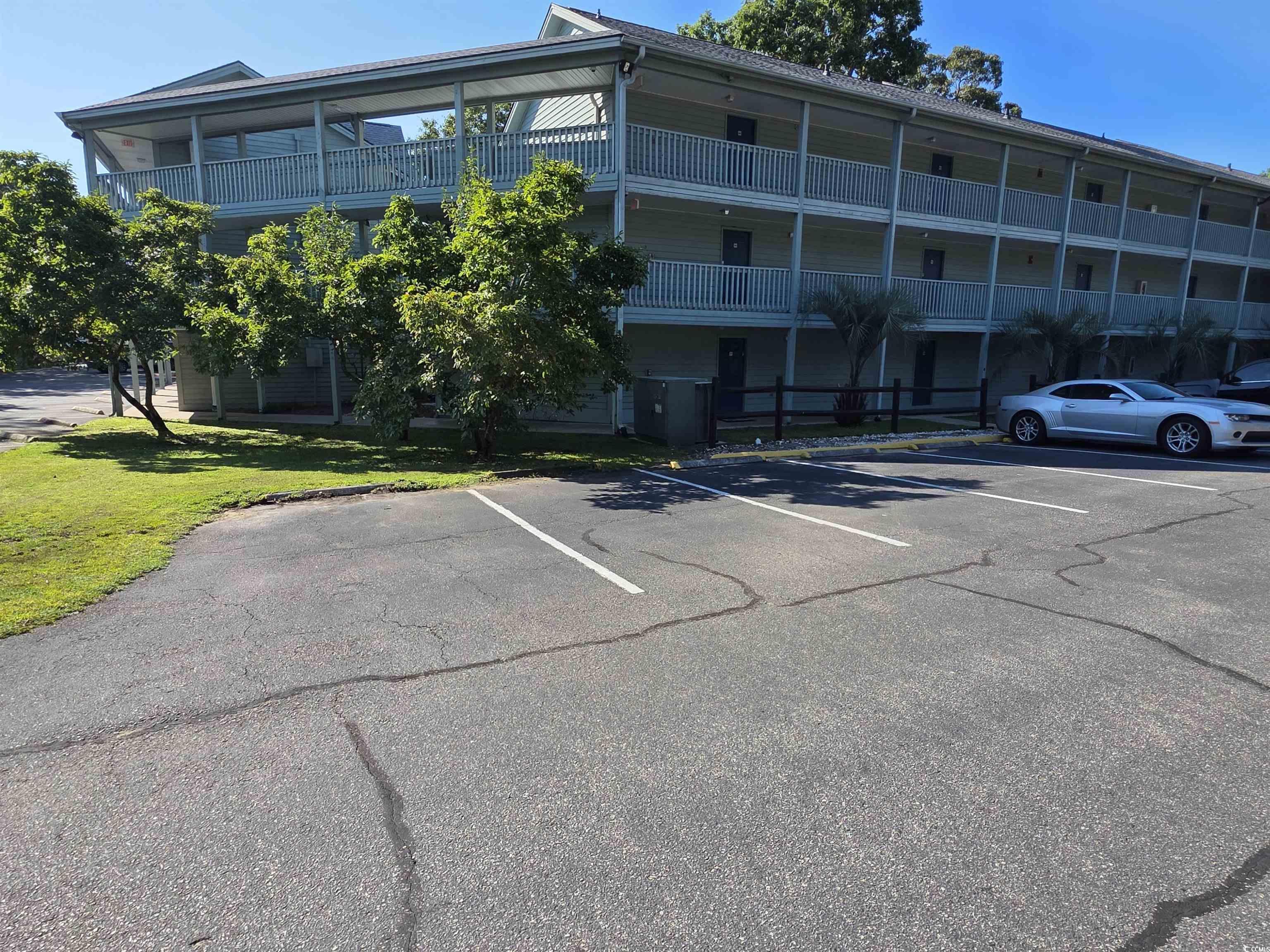 Image 1: View of property featuring uncovered parking Image 1: View of property featuring uncovered parking