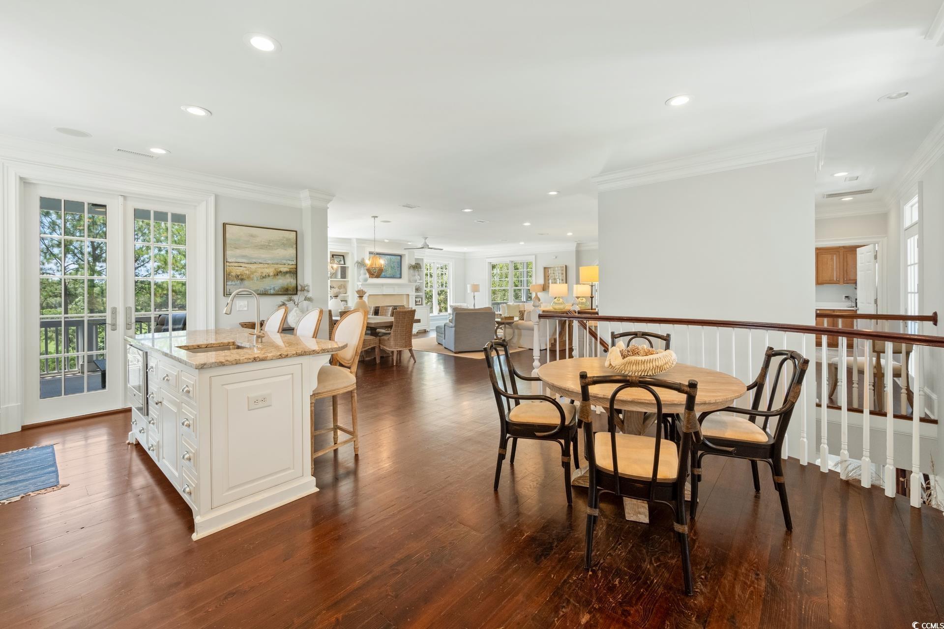 Image 4: Dining room with healthy amount of natural light,