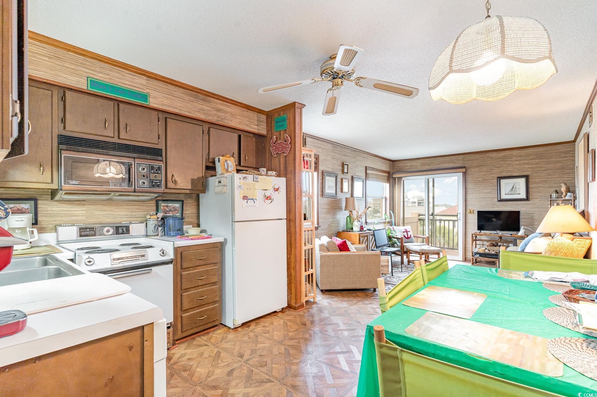 Image 4: Kitchen featuring ceiling fan, sink, white applian Image 4: Kitchen featuring ceiling fan, sink, white applian