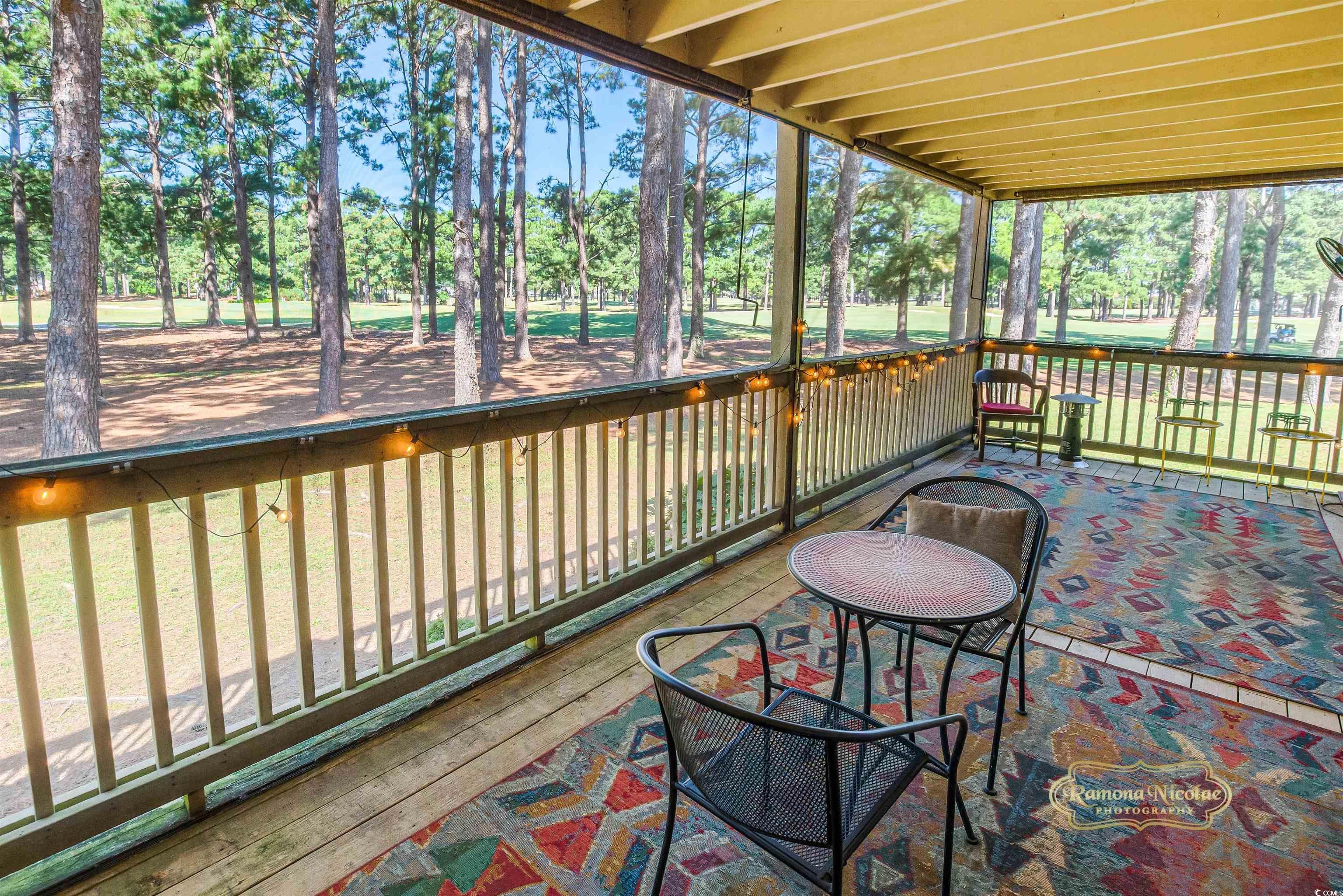 Image 2: Sunroom with view of wooded area
