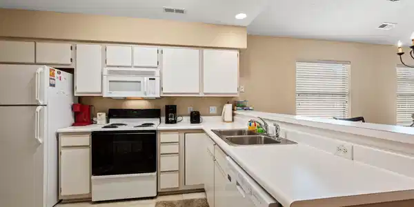 Image 3: Kitchen featuring white appliances, light tile pat Image 3: Kitchen featuring white appliances, light tile pat