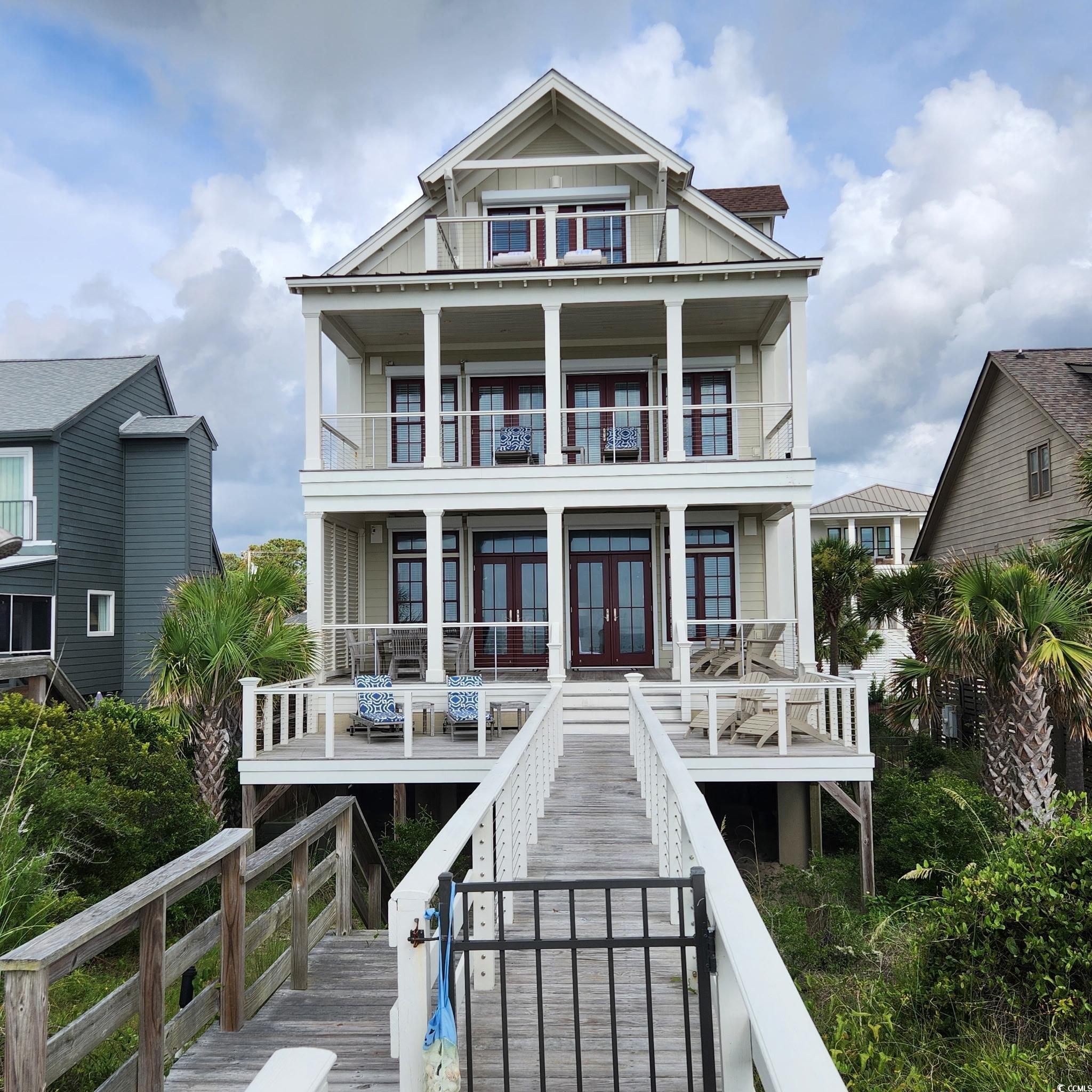 Image 4: Rear view of property featuring french doors and b
