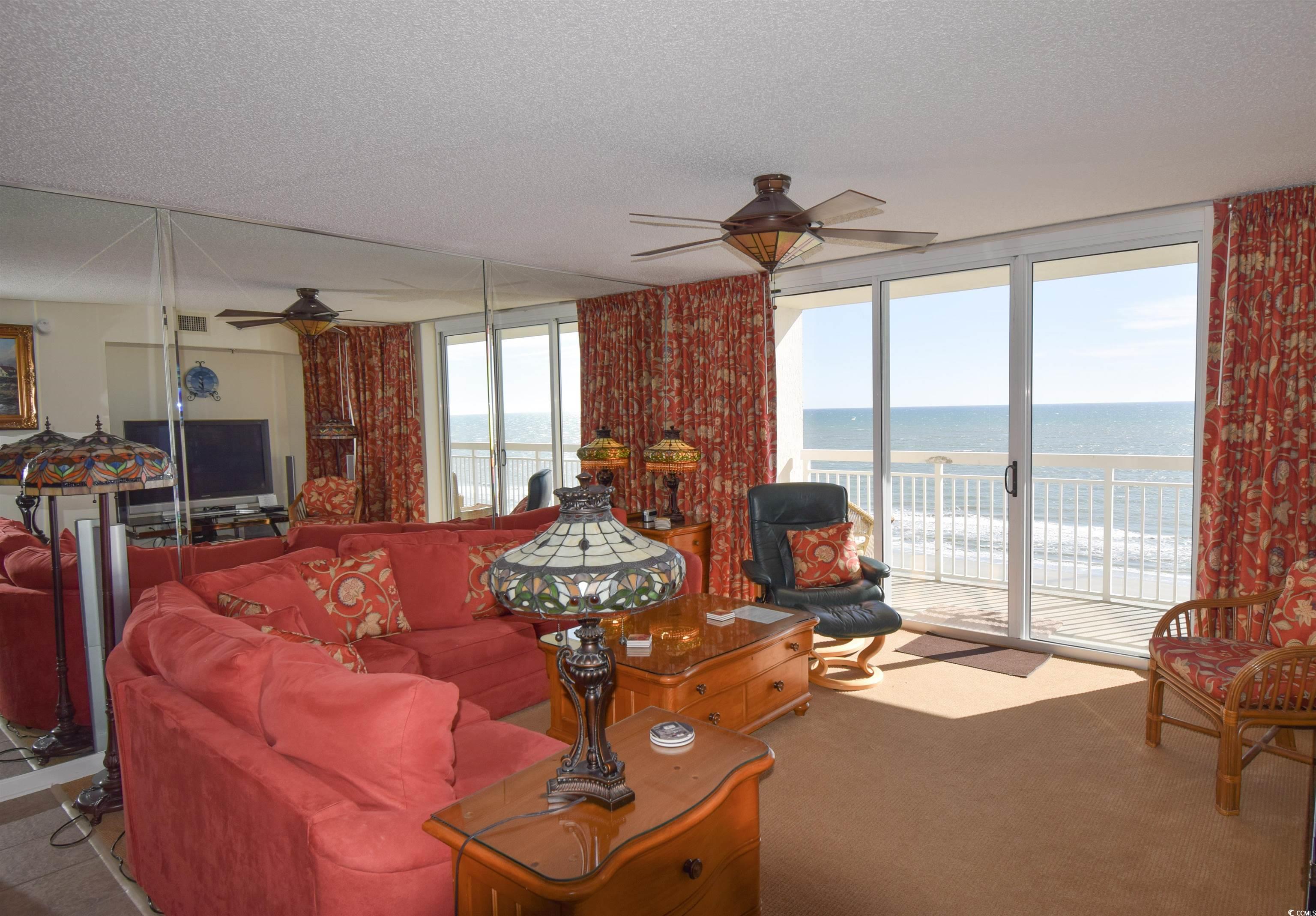 Image 3: Carpeted living room featuring floor to ceiling wi Image 3: Carpeted living room featuring floor to ceiling wi