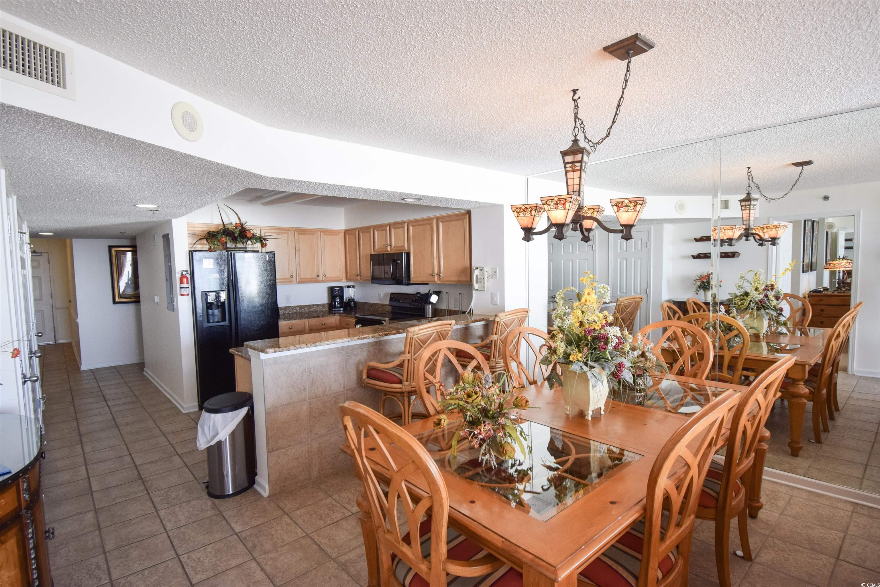 Image 4: Dining area featuring light tile patterned floors, Image 4: Dining area featuring light tile patterned floors,