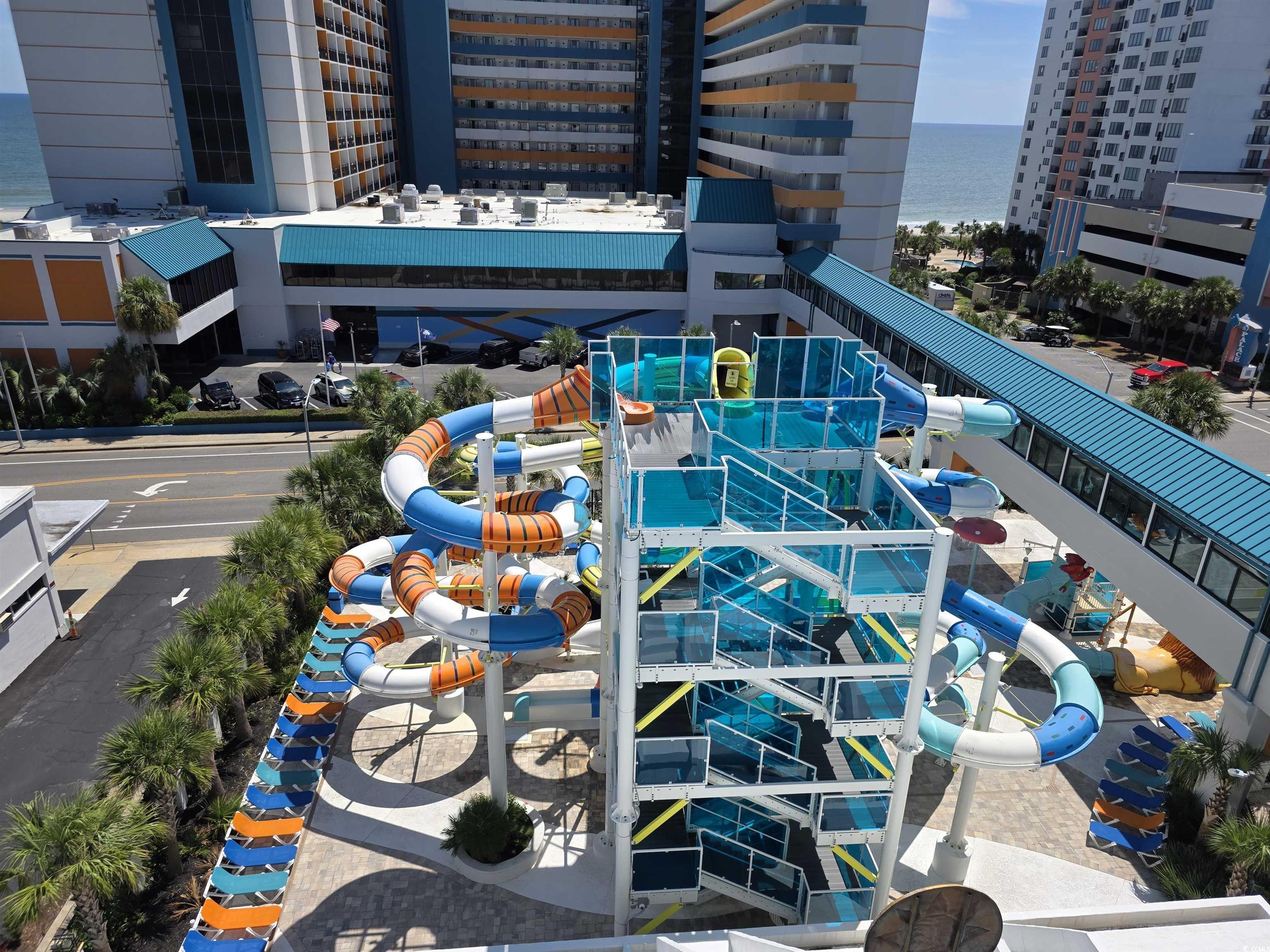 Image 3: Balcony featuring a water view