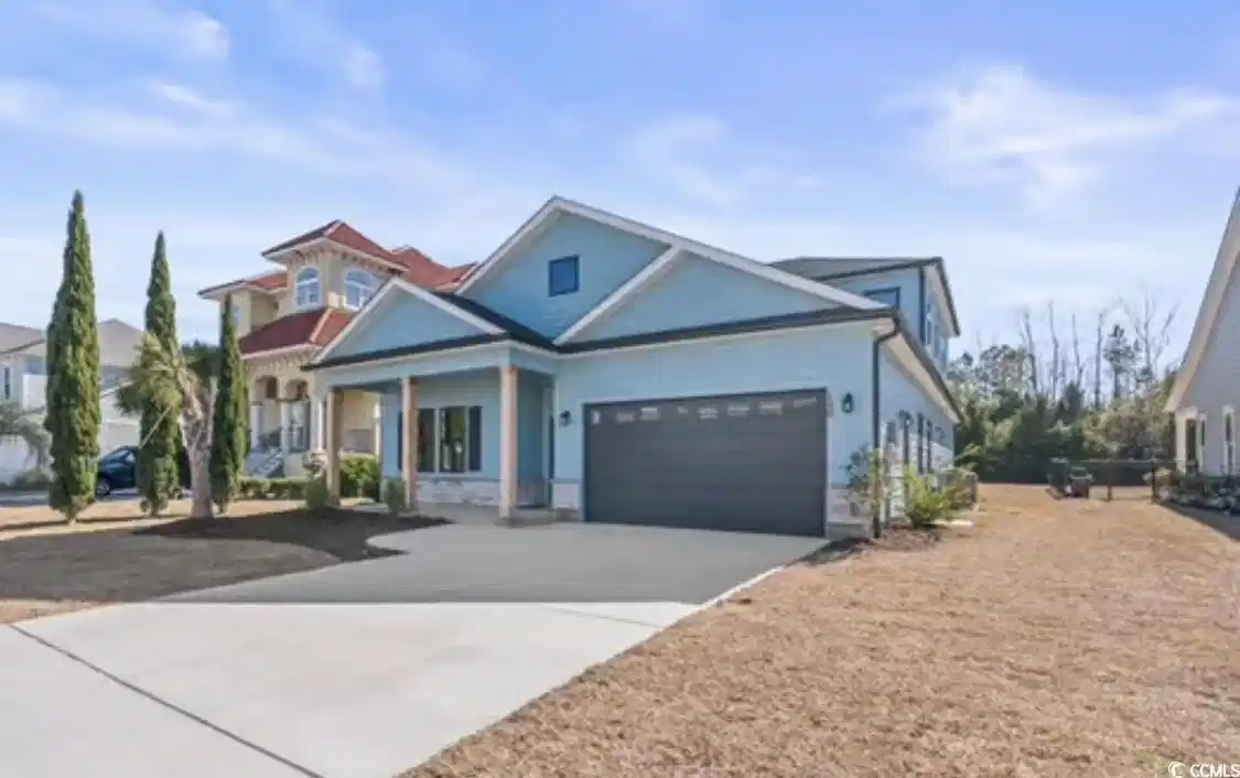 Image 1: View of front of house featuring driveway, covered Image 1: View of front of house featuring driveway, covered
