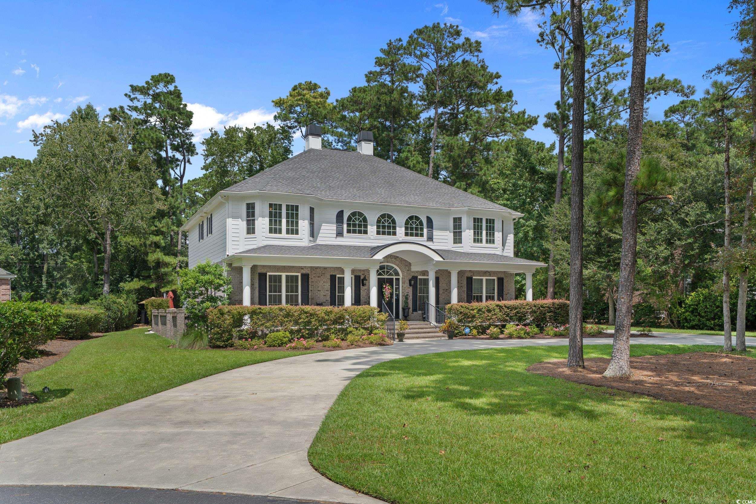 Image 2: View of front facade featuring a porch, a front la
