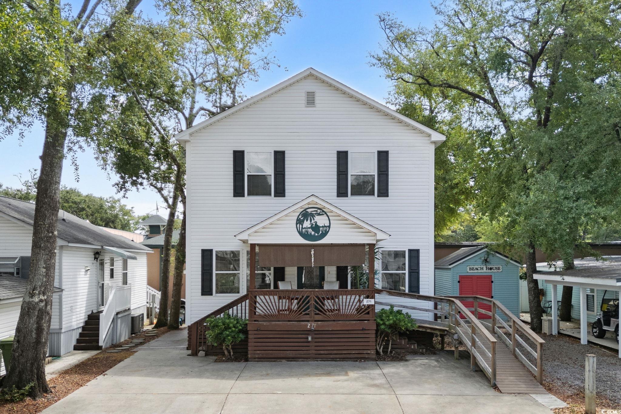 Image 2: View of front of home with an outbuilding Image 2: View of front of home with an outbuilding