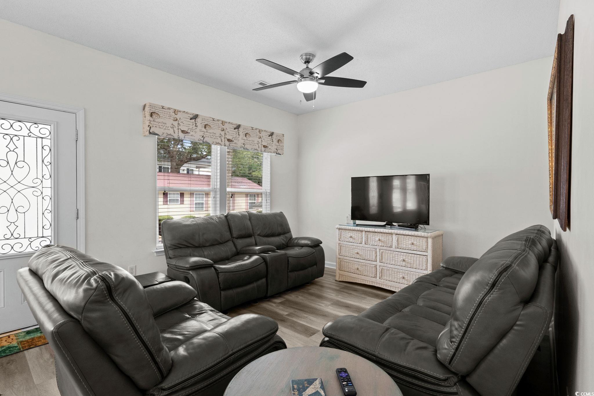 Image 4: Living area featuring wood finished floors and cei Image 4: Living area featuring wood finished floors and cei