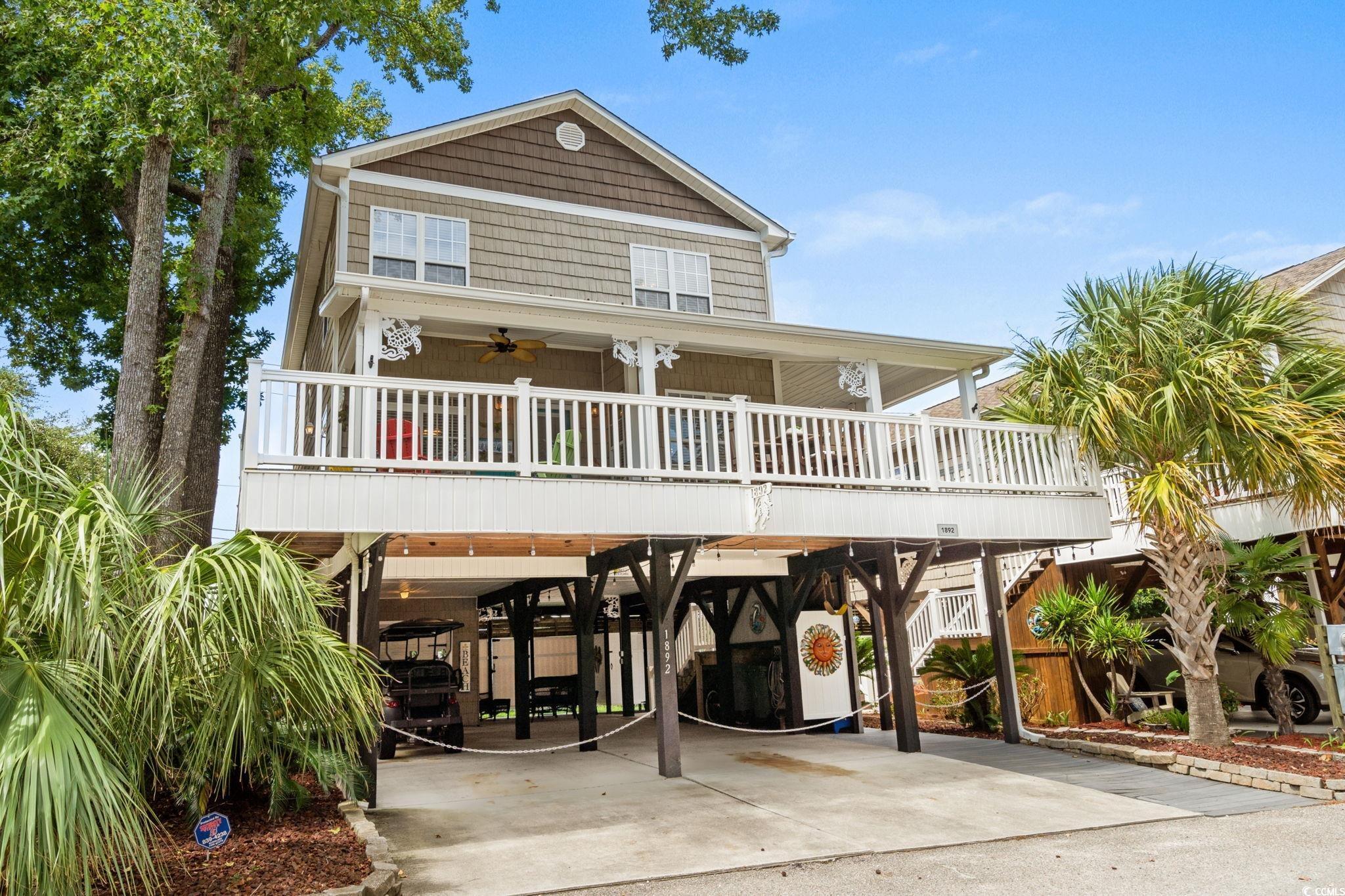 Image 3: View of front of property with a carport, a ceilin