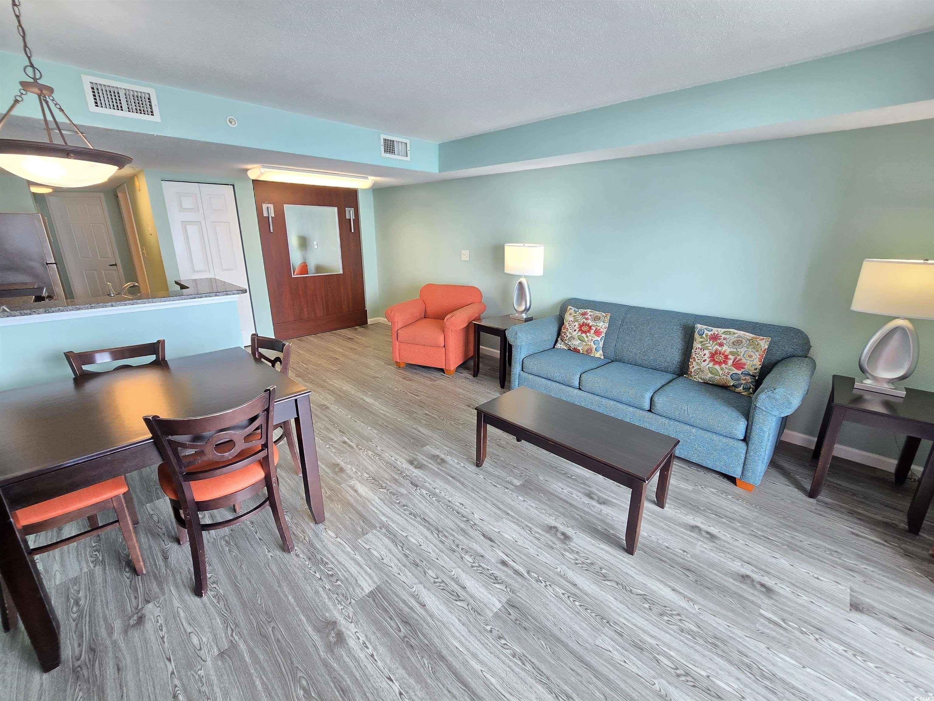 Image 4: Living area featuring light wood finished floors Image 4: Living area featuring light wood finished floors